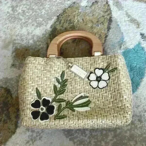 COVINGTON woven clutch bag